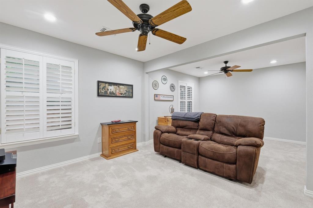 2012 Hayden Lane Corinth, TX 76210 - Photo 32 of 40 a living room with furniture and a window