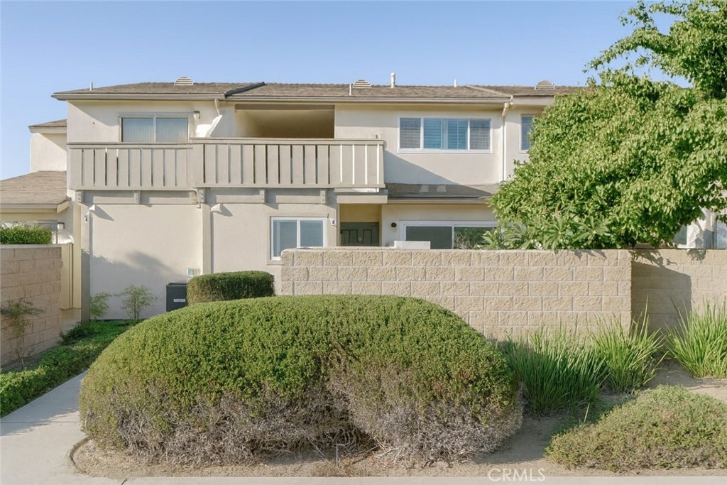 5114 West 1st Street, Unit C Santa Ana, CA 92703 - Photo 1 of 26 a view of a house with a yard