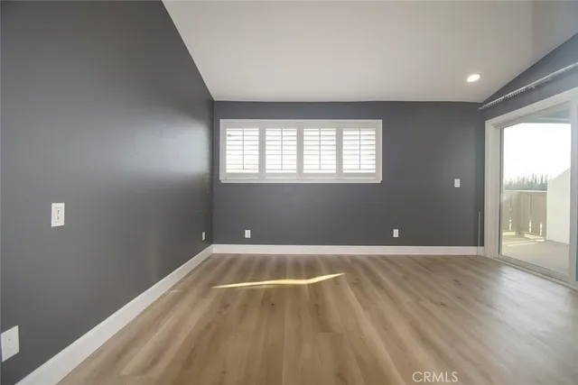a bathroom with a granite countertop toilet sink and mirror