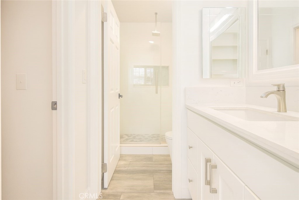 5114 West 1st Street, Unit C Santa Ana, CA 92703 - Photo 20 of 26 a bathroom with a sink and a mirror