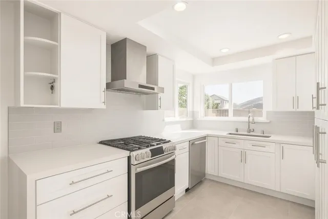a kitchen with a sink stove and cabinets