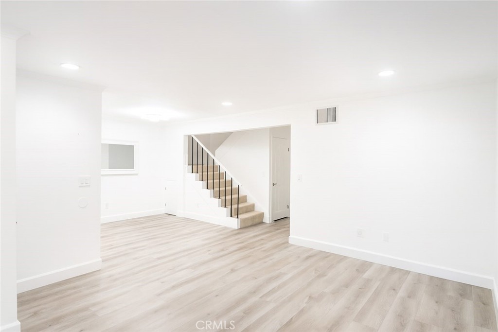 5114 West 1st Street, Unit C Santa Ana, CA 92703 - Photo 6 of 26 a view of entryway with wooden floor