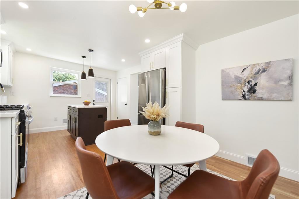 3486 Evergreen Road Pittsburgh, PA 15237 - Photo 10 of 25 a view of a dining room with furniture and wooden floor