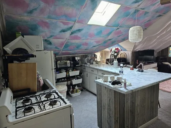 a kitchen with stainless steel appliances granite countertop a stove and a sink