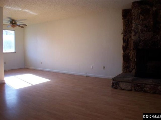 14045 Feldspar Court Reno, NV 89521 - Photo 3 of 13 a view of empty room with windows