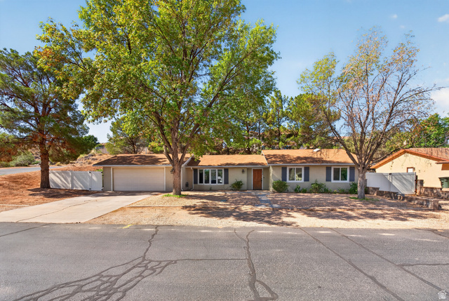 1690 Maplewood Way St. George, UT 84790 - Photo 1 of 17 Charming single-story residence with a brick exterior and covered carport