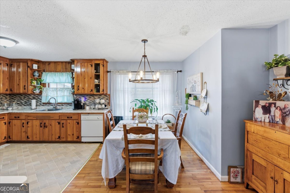 129 George West Road Cedartown, GA 30125 - Photo 12 of 36 a view of a kitchen with granite countertop lots of counter top space and wooden floor