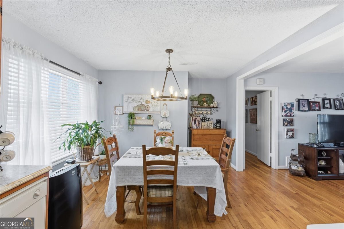 129 George West Road Cedartown, GA 30125 - Photo 13 of 36 a view of a dining room with furniture window and wooden floor