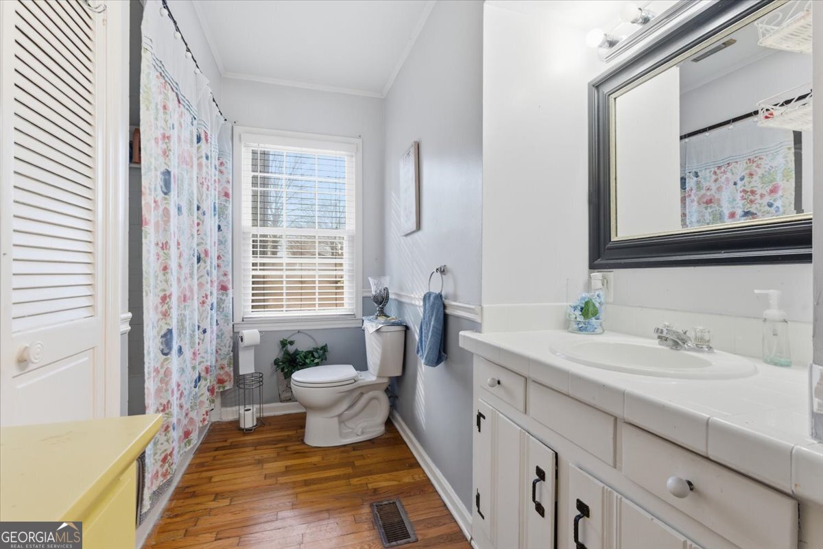 129 George West Road Cedartown, GA 30125 - Photo 20 of 36 a spacious bathroom with a sink a large mirror and a shower