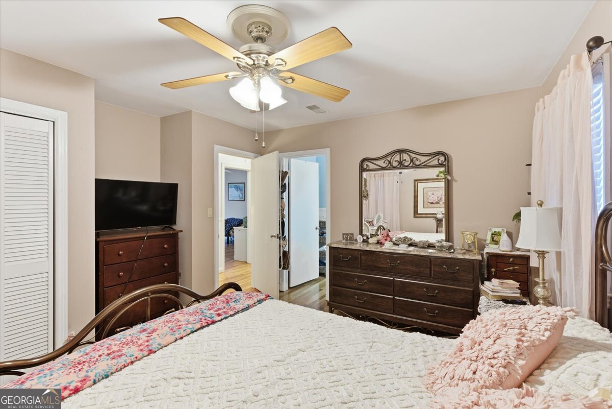 129 George West Road Cedartown, GA 30125 - Photo 23 of 36 a bedroom with a bed and a flat screen tv