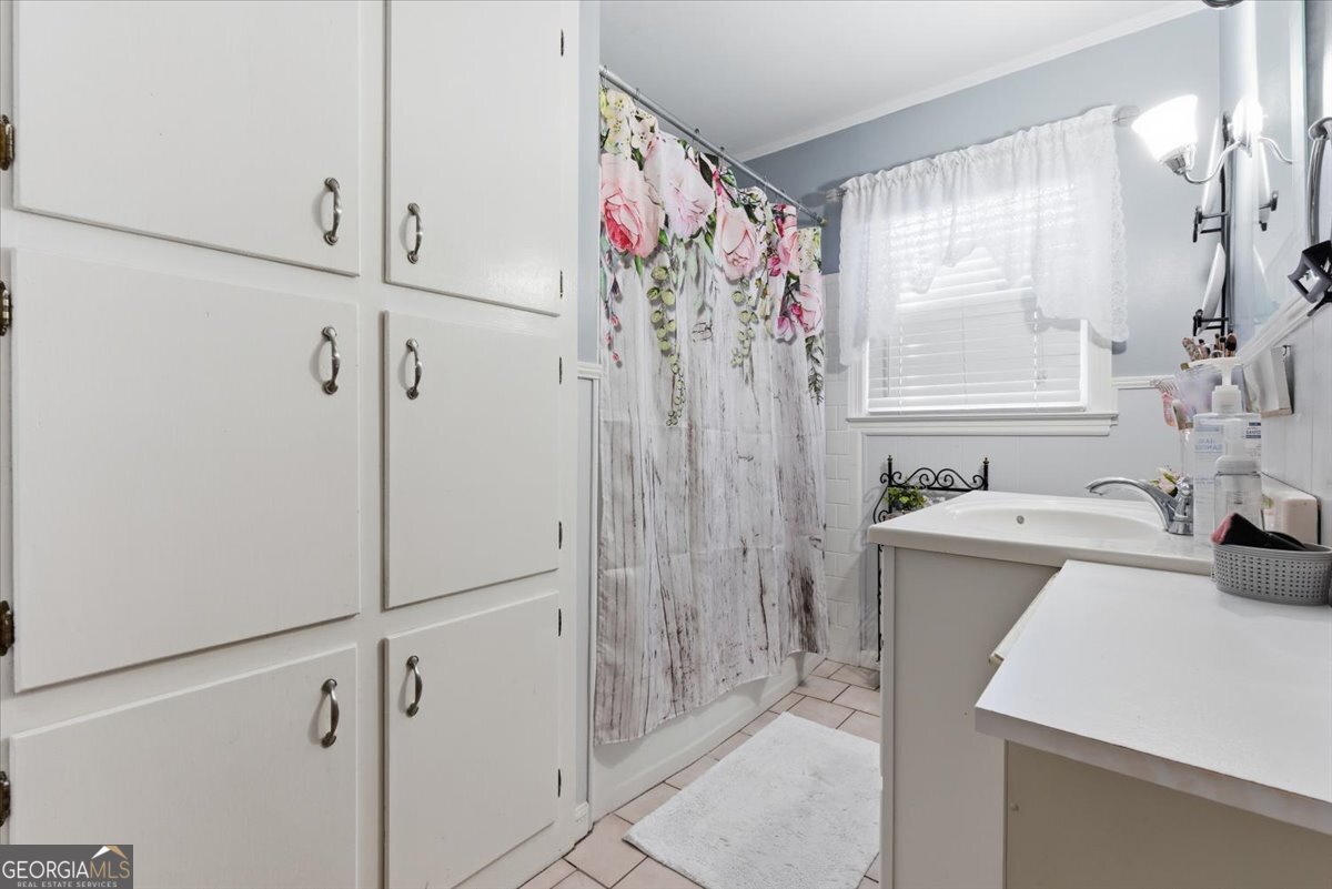 129 George West Road Cedartown, GA 30125 - Photo 24 of 36 a bathroom with a sink a mirror and a shower
