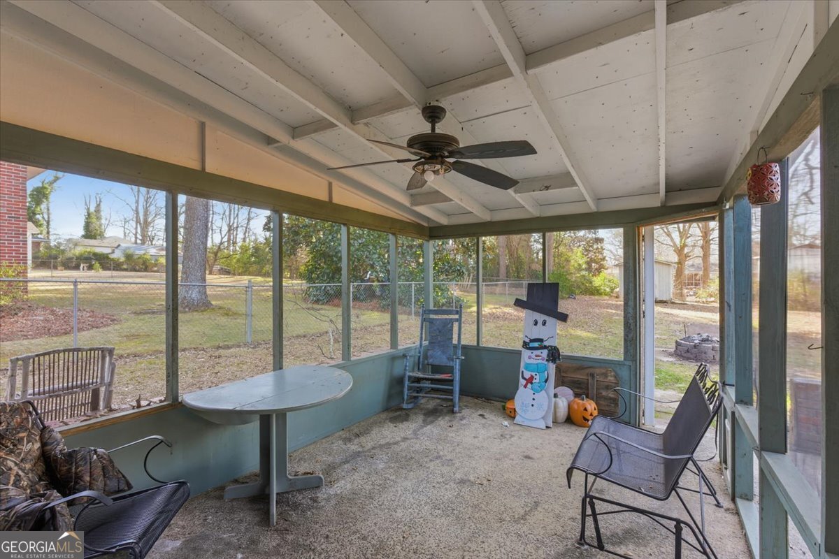 129 George West Road Cedartown, GA 30125 - Photo 26 of 36 a living room with furniture and a floor to ceiling window