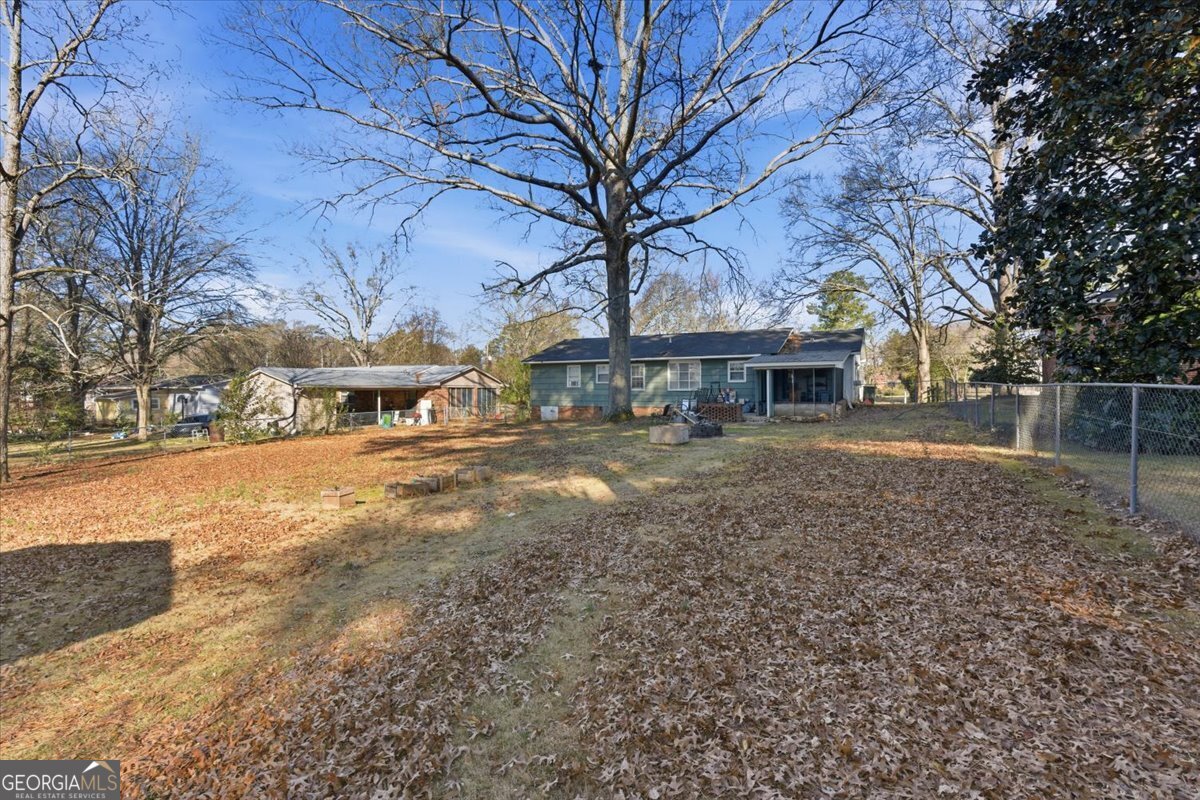 129 George West Road Cedartown, GA 30125 - Photo 29 of 36 a view of house with yard and trees in the background