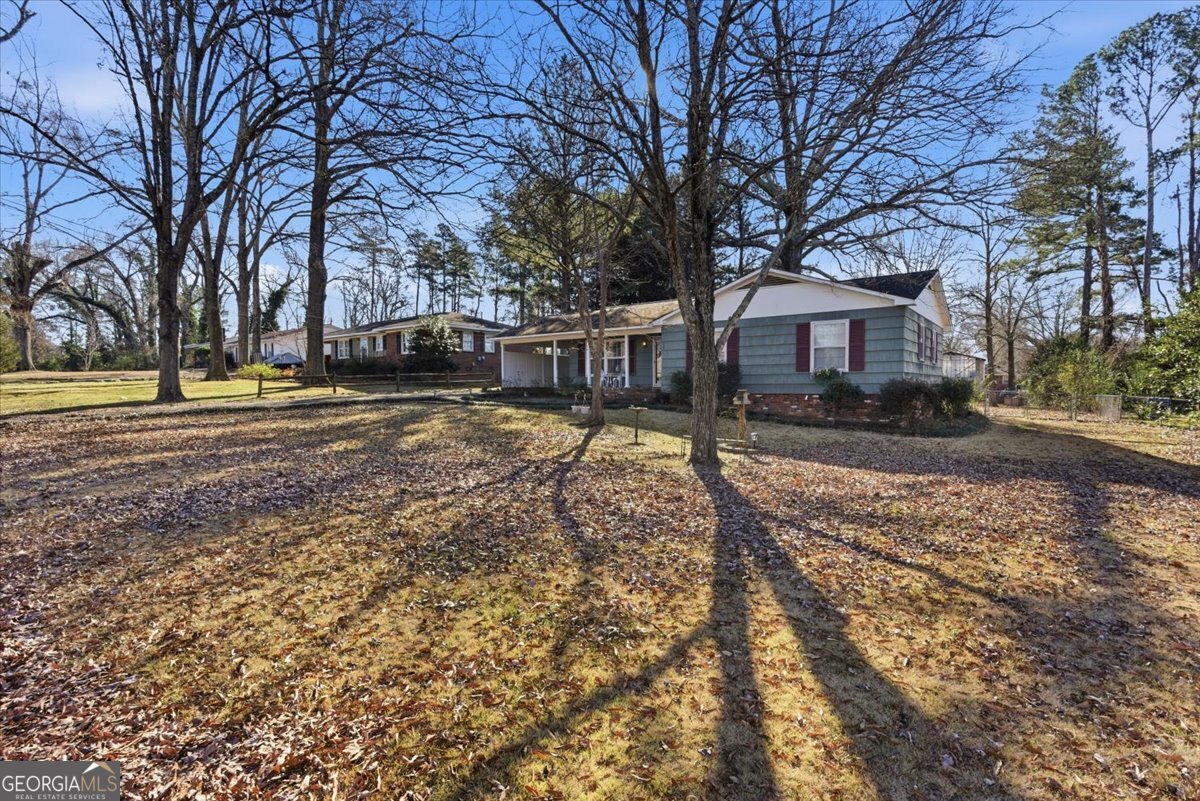 129 George West Road Cedartown, GA 30125 - Photo 4 of 36 a view of a house with a yard covered in snow