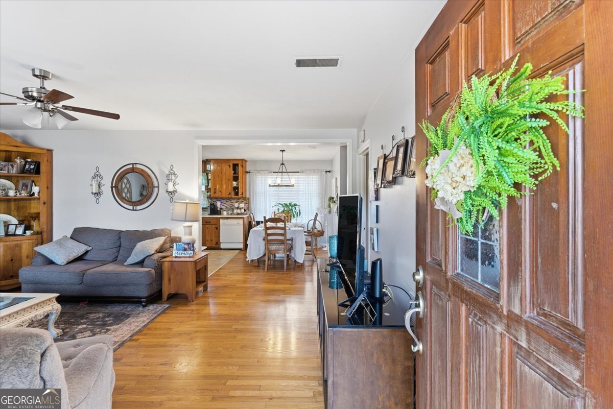 129 George West Road Cedartown, GA 30125 - Photo 7 of 36 a living room with furniture and a clock