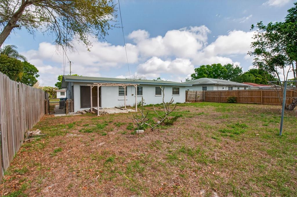 1541 Illinois Road Clearwater, FL 33756 - Photo 14 of 44 a view of a house with backyard and garden