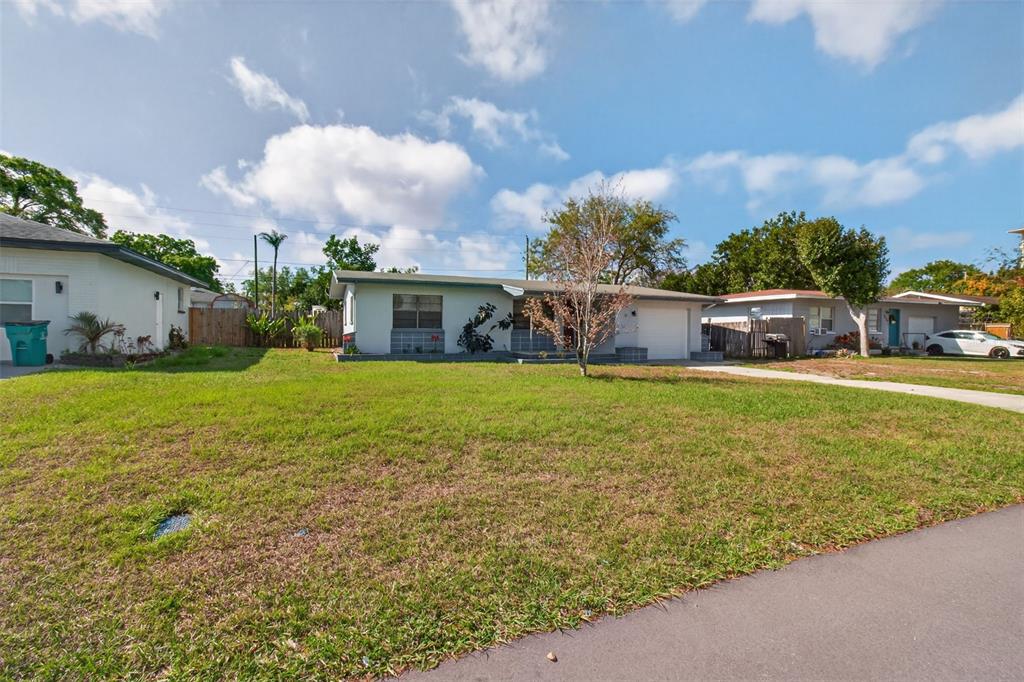 1541 Illinois Road Clearwater, FL 33756 - Photo 18 of 44 a view of a house with a yard