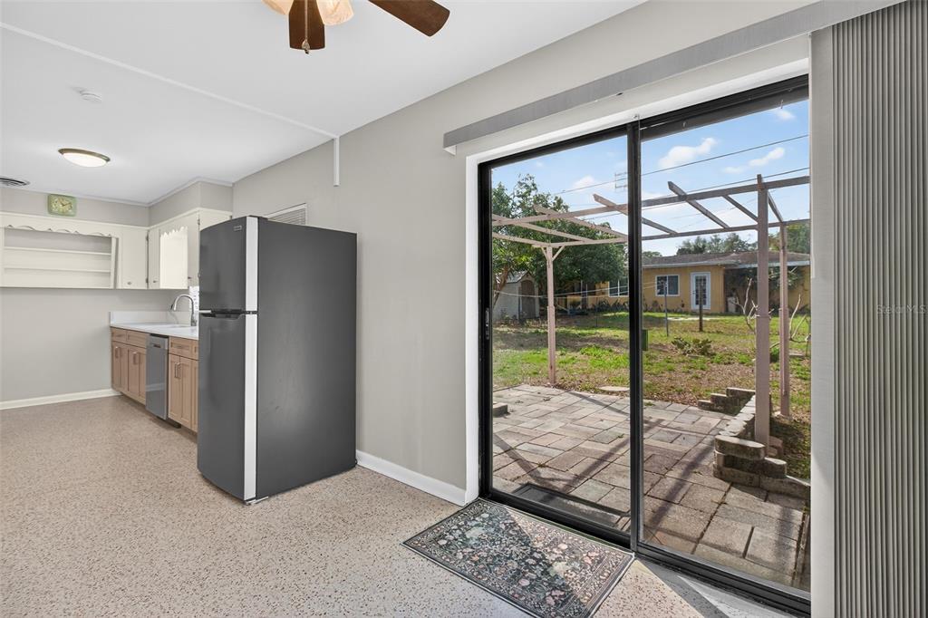 1541 Illinois Road Clearwater, FL 33756 - Photo 23 of 44 a kitchen with a refrigerator and wooden floor