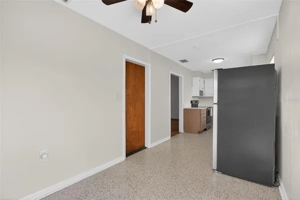a view of a kitchen with a refrigerator