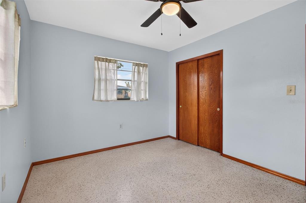 1541 Illinois Road Clearwater, FL 33756 - Photo 30 of 44 an empty room with windows and closet