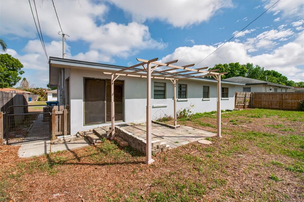 1541 Illinois Road Clearwater, FL 33756 - Photo 32 of 44 a view of a house with a porch