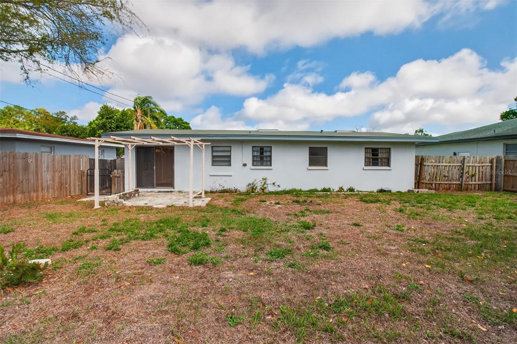 1541 Illinois Road Clearwater, FL 33756 - Photo 36 of 44 a front view of house with yard and trees around