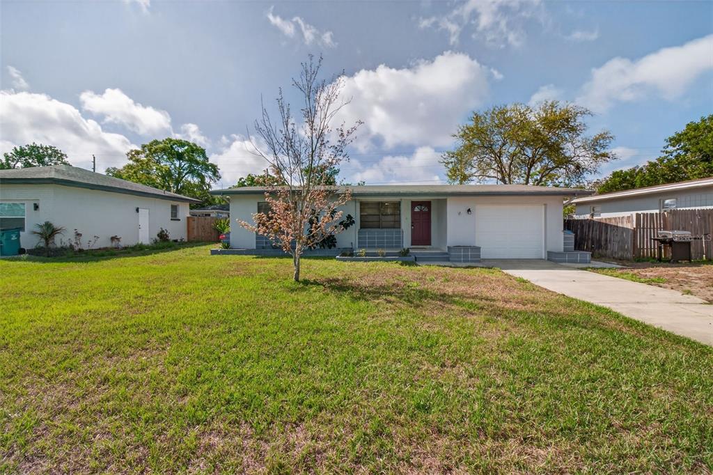 1541 Illinois Road Clearwater, FL 33756 - Photo 43 of 44 a view of a house with a yard