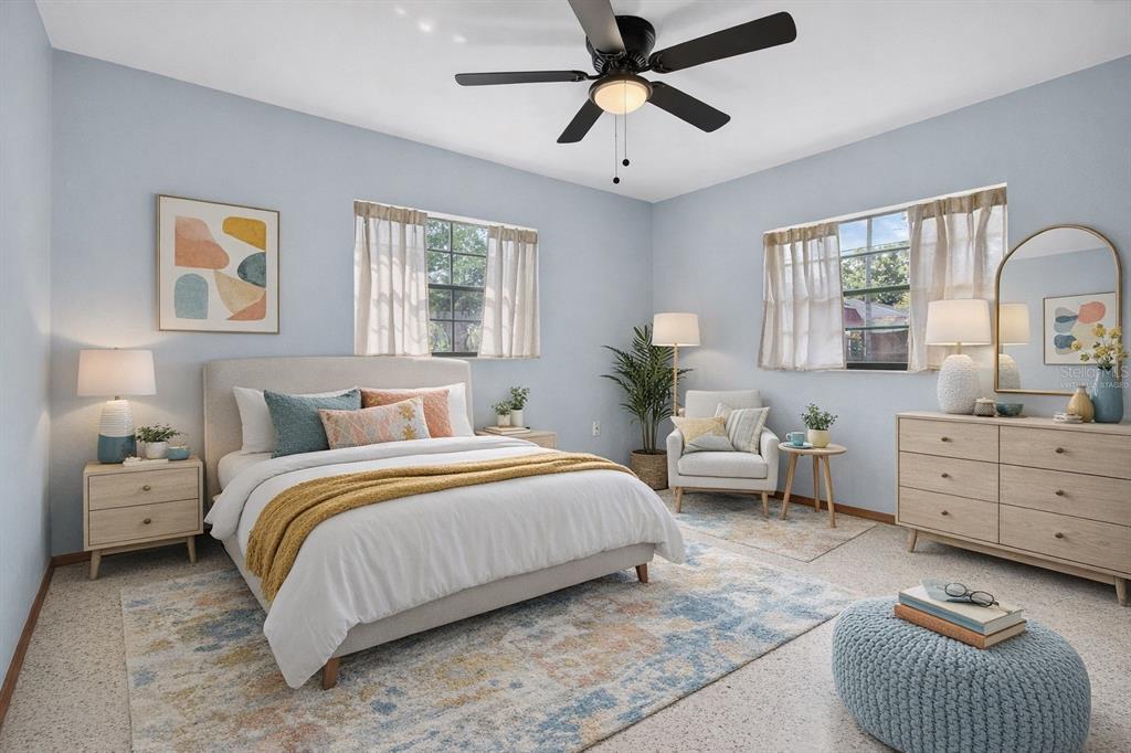 1541 Illinois Road Clearwater, FL 33756 - Photo 5 of 44 a bedroom with a bed couch and window