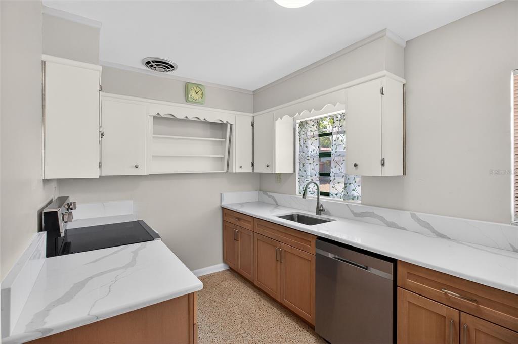 1541 Illinois Road Clearwater, FL 33756 - Photo 6 of 44 a kitchen with a sink dishwasher and cabinets