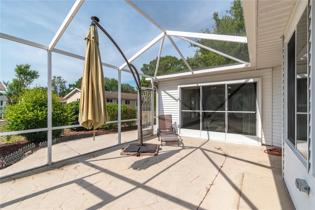8156 Southwest 108th Ln Road Ocala, FL 34481 - Photo 33 of 50 a view of a balcony with a large window and wooden floor