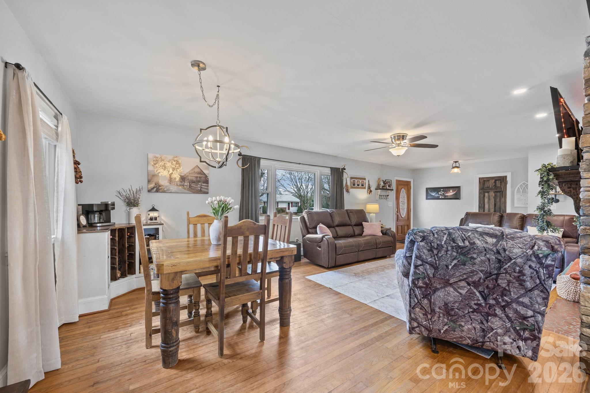 275 Tanner Street Rutherfordton, NC 28139 - Photo 22 of 44 a living room with furniture a rug and a chandelier