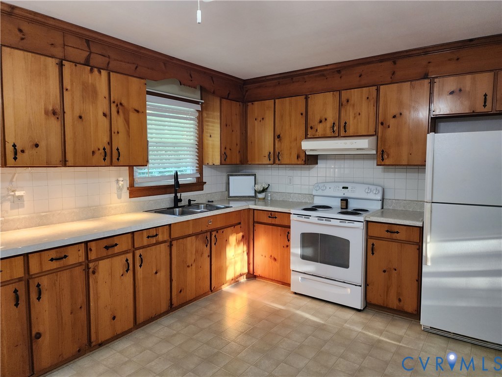 5325 Meadoway Road Richmond, VA 23234 - Photo 12 of 15 Kitchen with white appliances, light countertops,