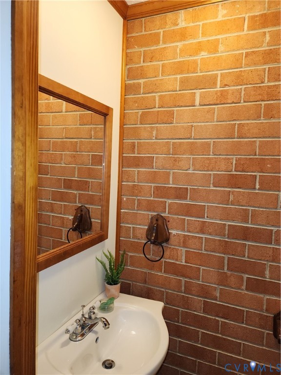 5325 Meadoway Road Richmond, VA 23234 - Photo 4 of 15 Bathroom featuring brick wall