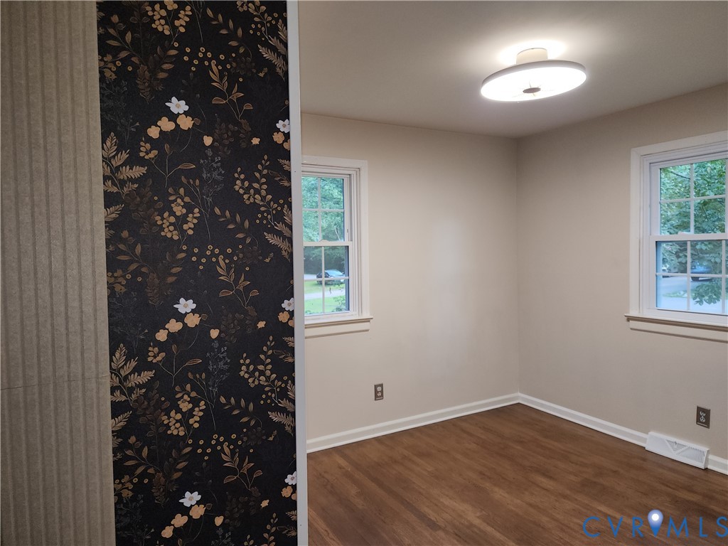 5325 Meadoway Road Richmond, VA 23234 - Photo 5 of 15 Spare room featuring dark wood-style floors and ba