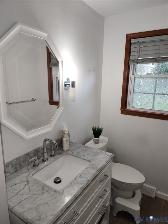 5325 Meadoway Road Richmond, VA 23234 - Photo 9 of 15 Bathroom with vanity and dark wood-type flooring