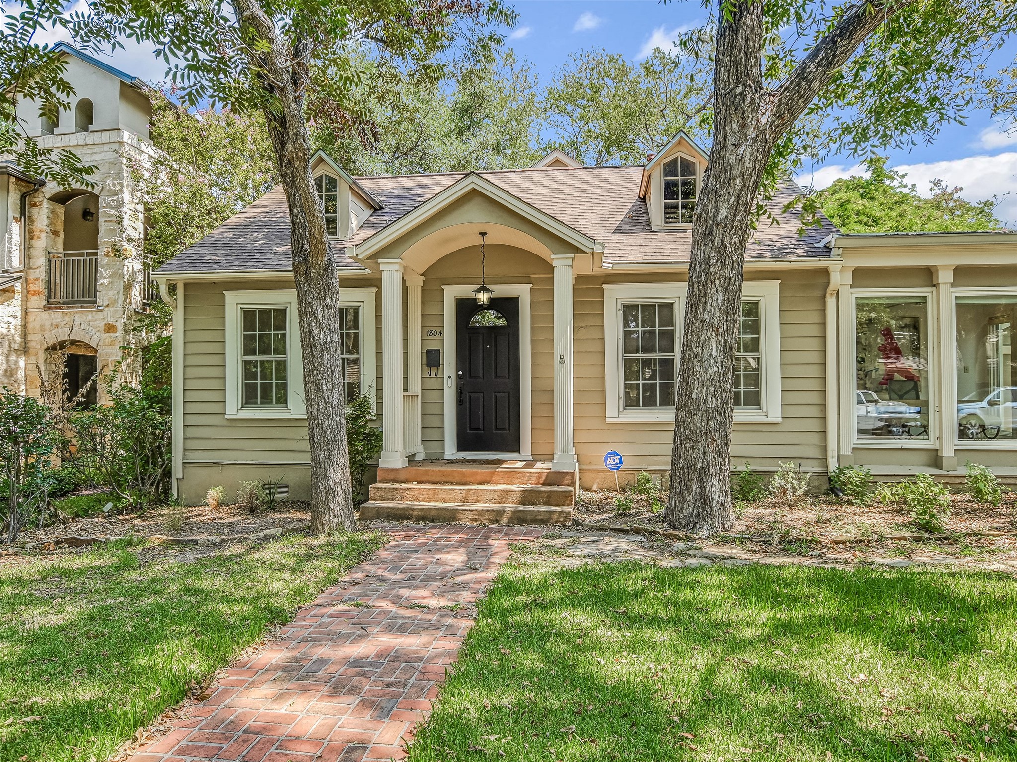 1804 Polo Road Austin, TX 78703 - Photo 19 of 19 View of front of home with a shingled roof and a front lawn