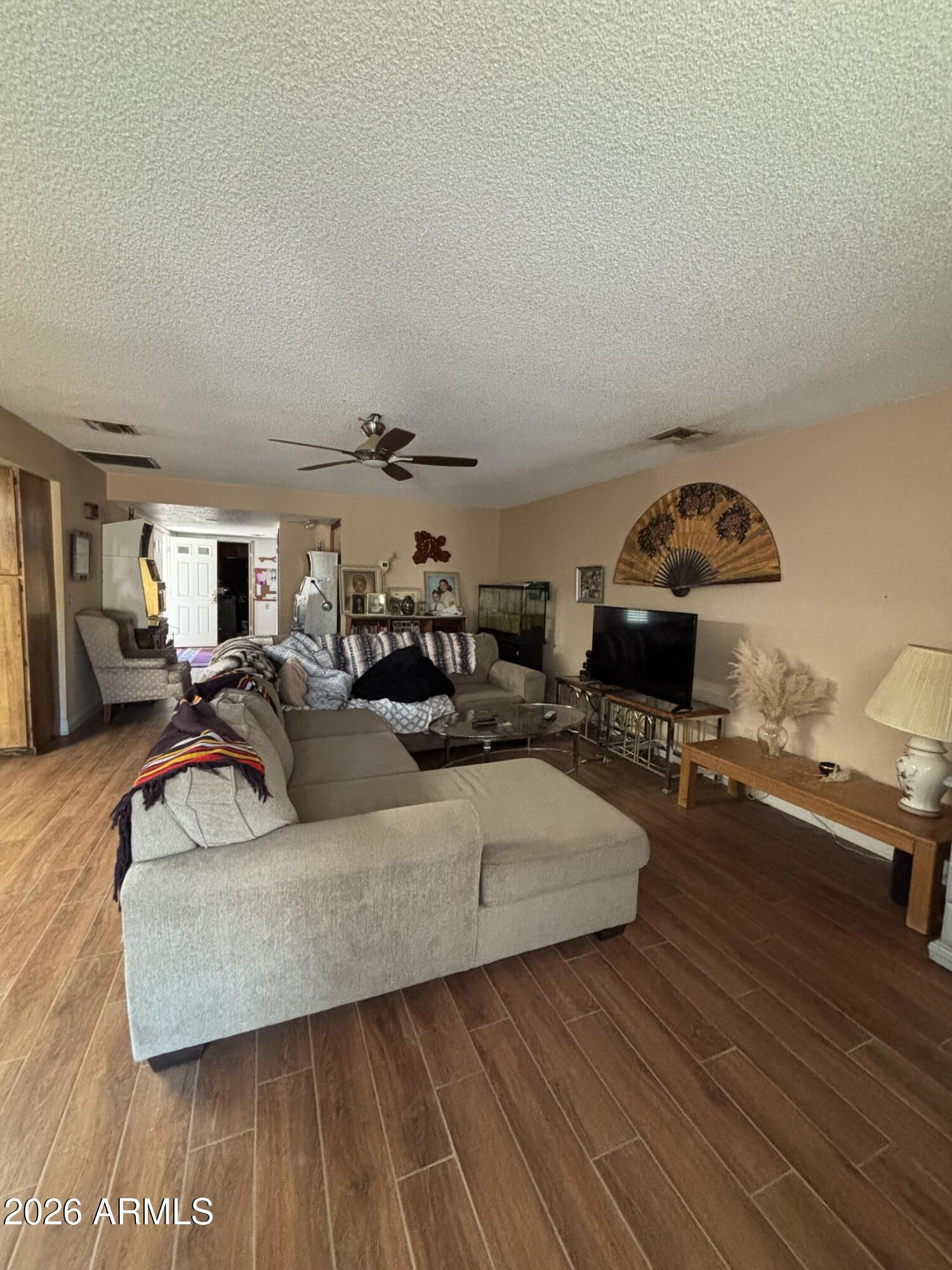 4934 West Fallen Leaf Lane Glendale, AZ 85310 - Photo 11 of 24 a living room with furniture and a wooden floor