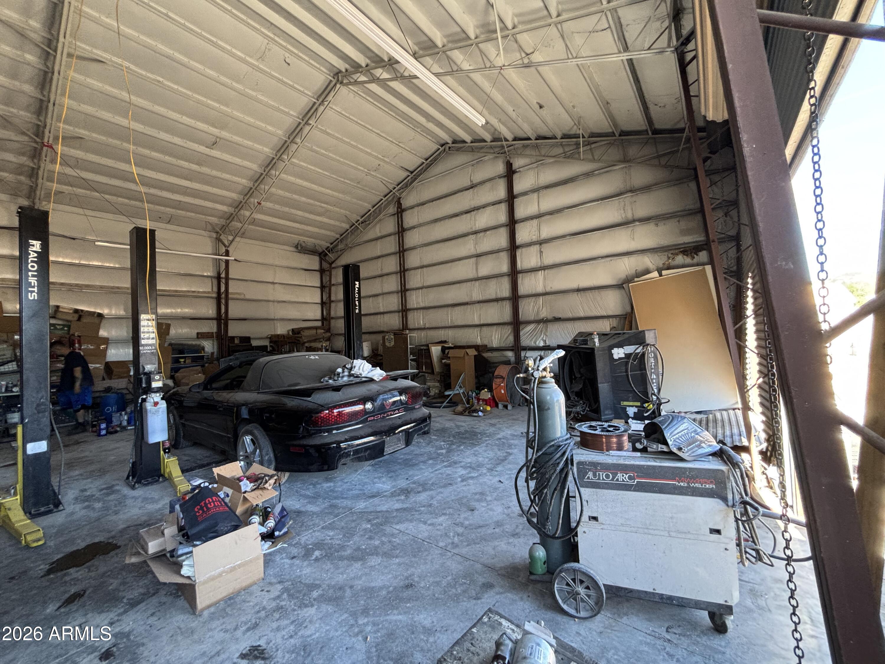 4934 West Fallen Leaf Lane Glendale, AZ 85310 - Photo 22 of 24 a living room with furniture and a flat screen tv