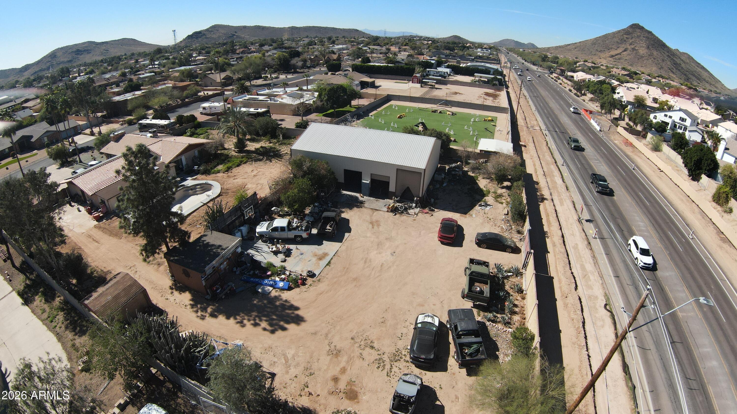4934 West Fallen Leaf Lane Glendale, AZ 85310 - Photo 6 of 24 an aerial view of multiple houses with yard