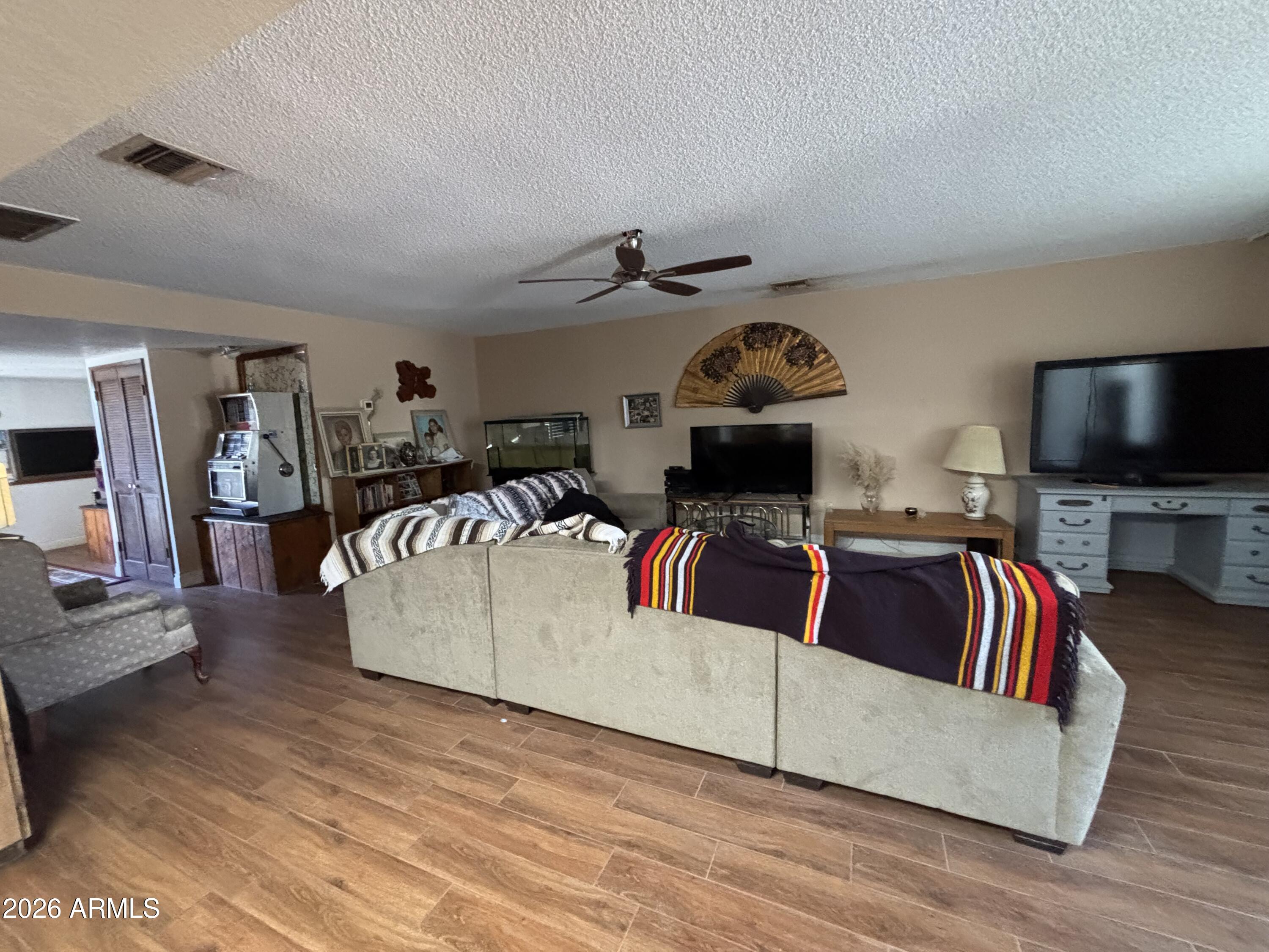 4934 West Fallen Leaf Lane Glendale, AZ 85310 - Photo 10 of 24 a living room with furniture and a flat screen tv