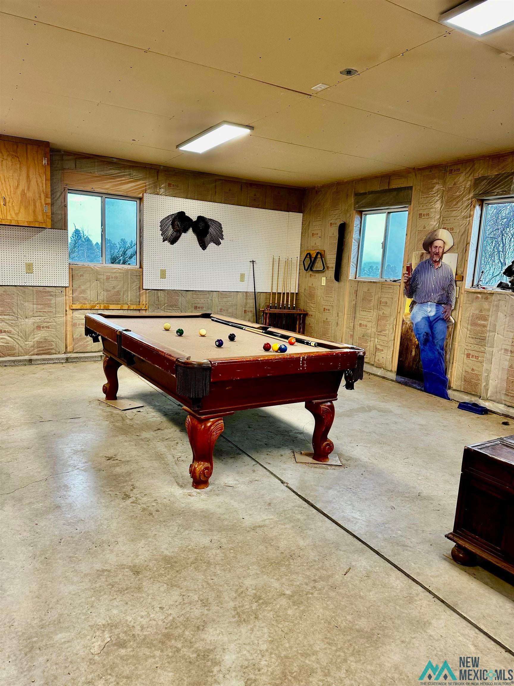 31 Bill Knight Gap Road Luna, NM 87824 - Photo 34 of 41 Playroom with billiards table, healthy amount of natural light, and concrete flooring