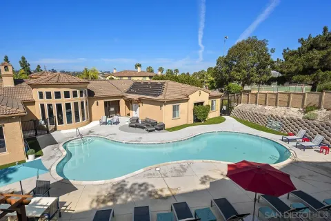 a view of a house with a swimming pool