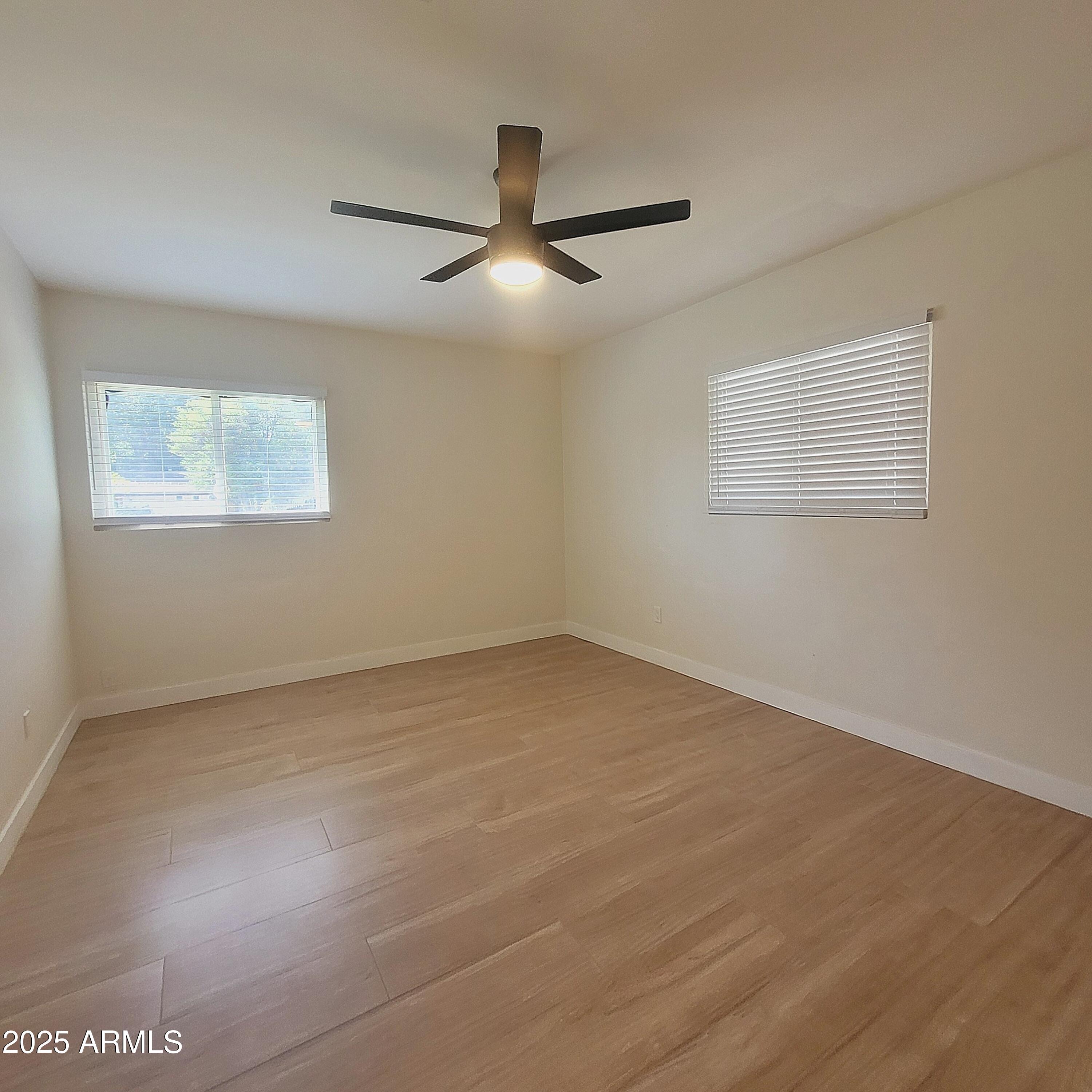 4028 East Edgemont Avenue Phoenix, AZ 85018 - Photo 16 of 27 a view of an empty room with a window