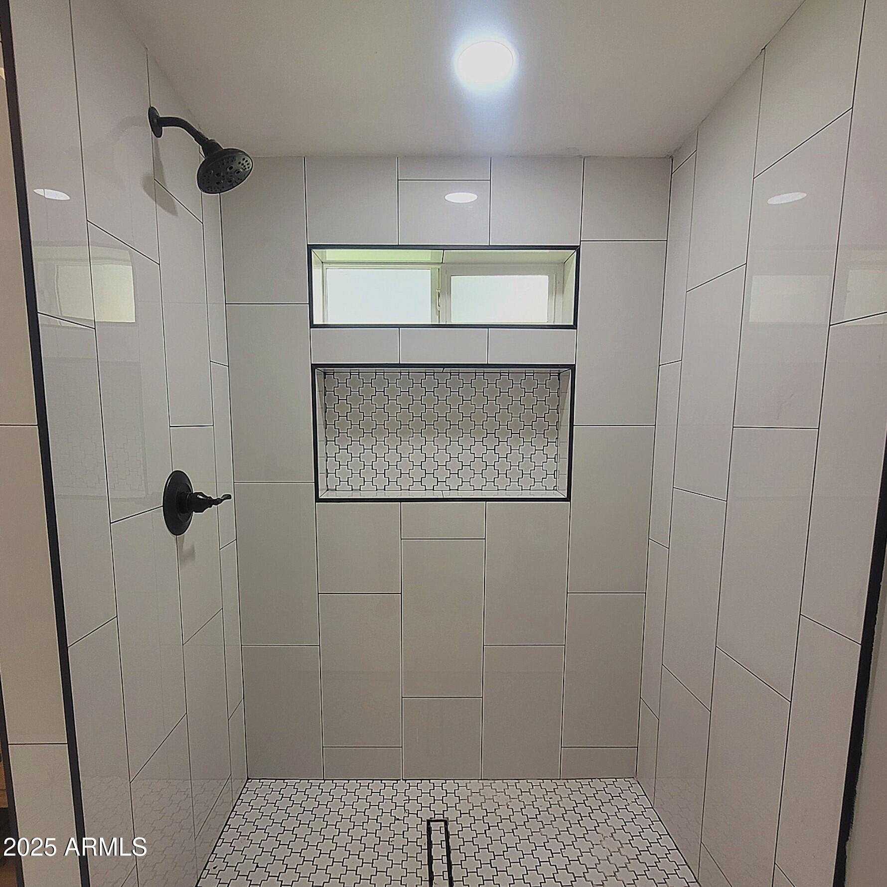 4028 East Edgemont Avenue Phoenix, AZ 85018 - Photo 22 of 27 a bathroom with a shower