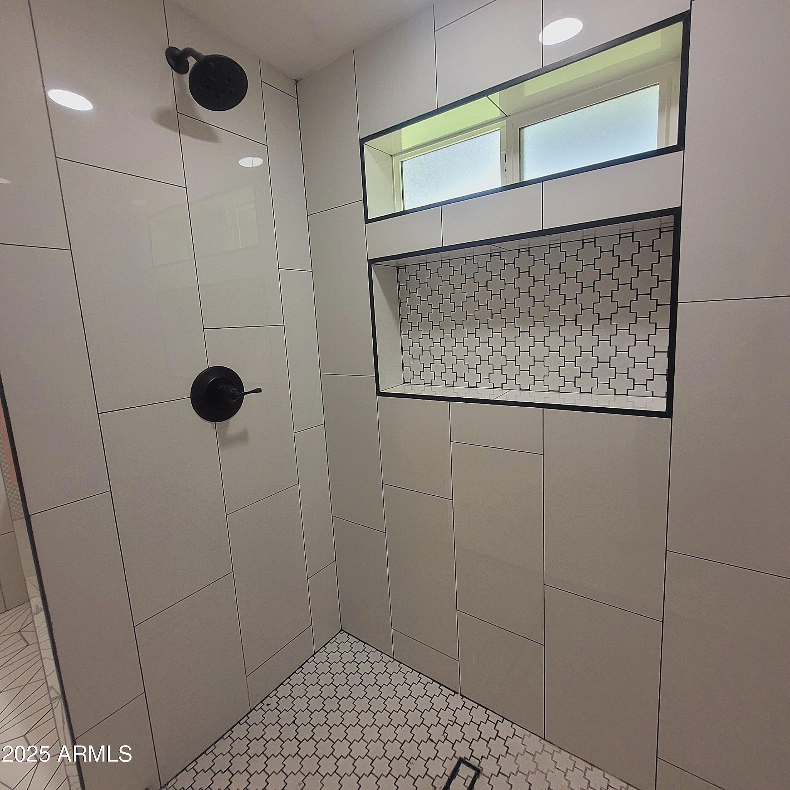 4028 East Edgemont Avenue Phoenix, AZ 85018 - Photo 23 of 27 a bathroom with a shower