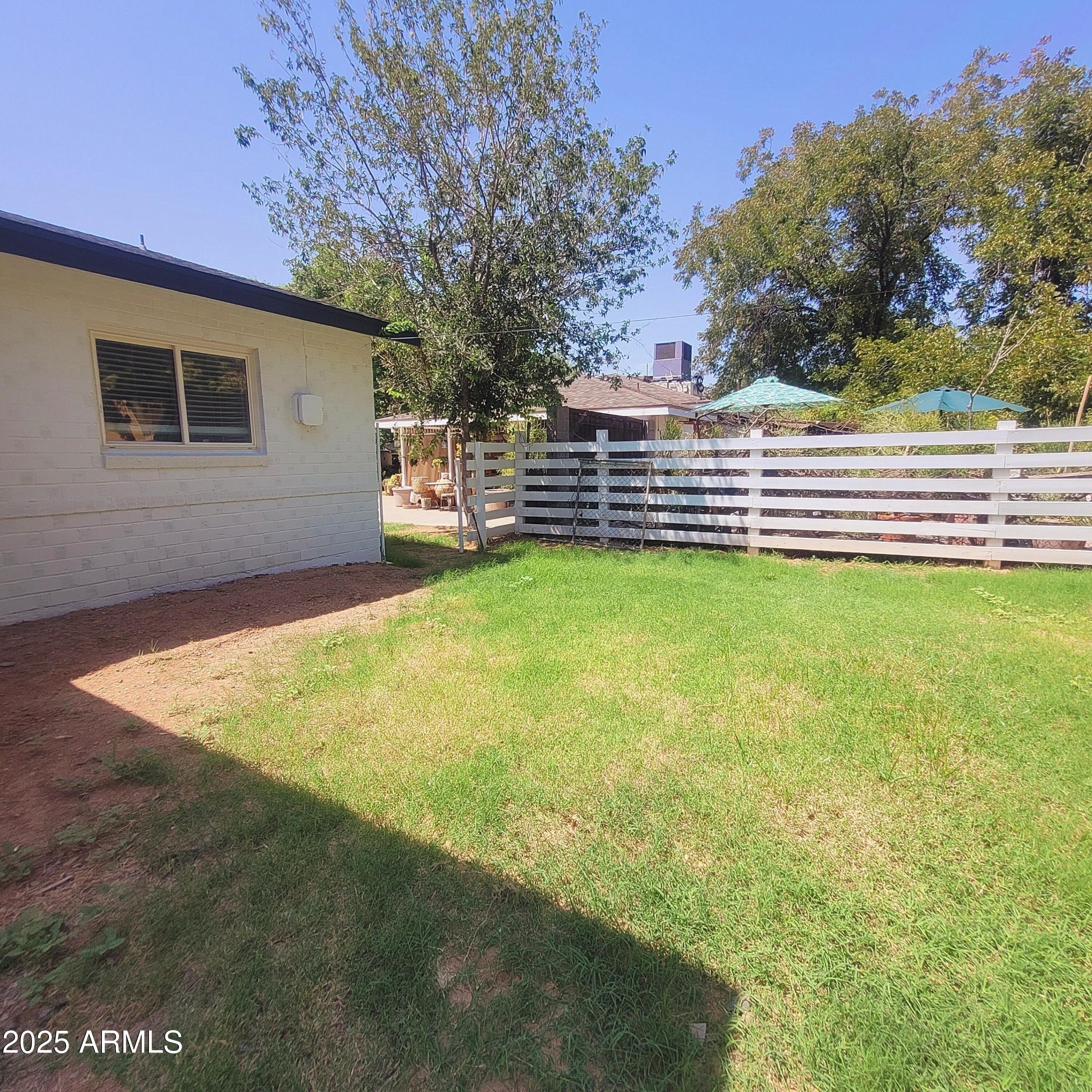 4028 East Edgemont Avenue Phoenix, AZ 85018 - Photo 26 of 27 a view of a backyard with a small cabin