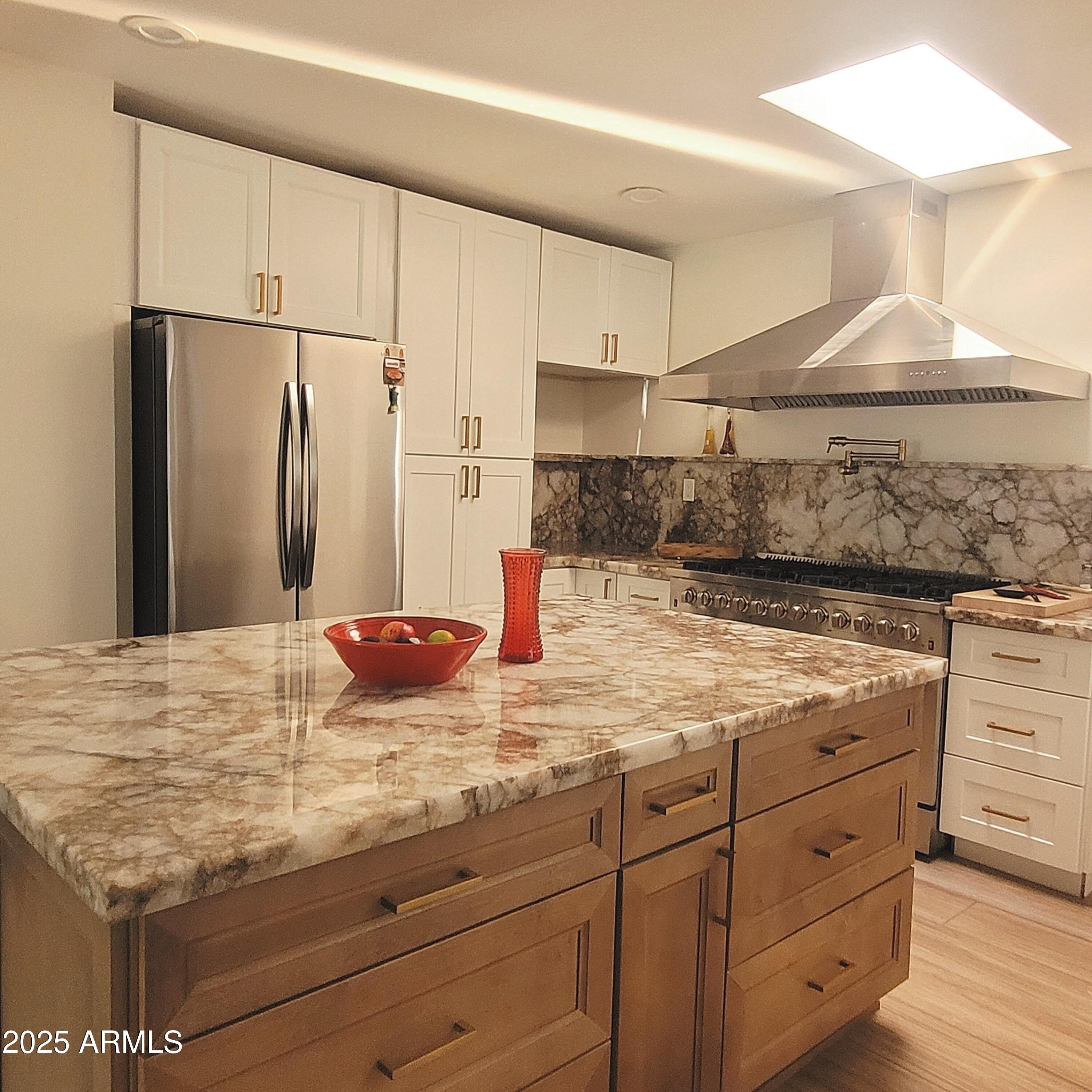 4028 East Edgemont Avenue Phoenix, AZ 85018 - Photo 8 of 27 a kitchen with cabinets appliances and a counter space