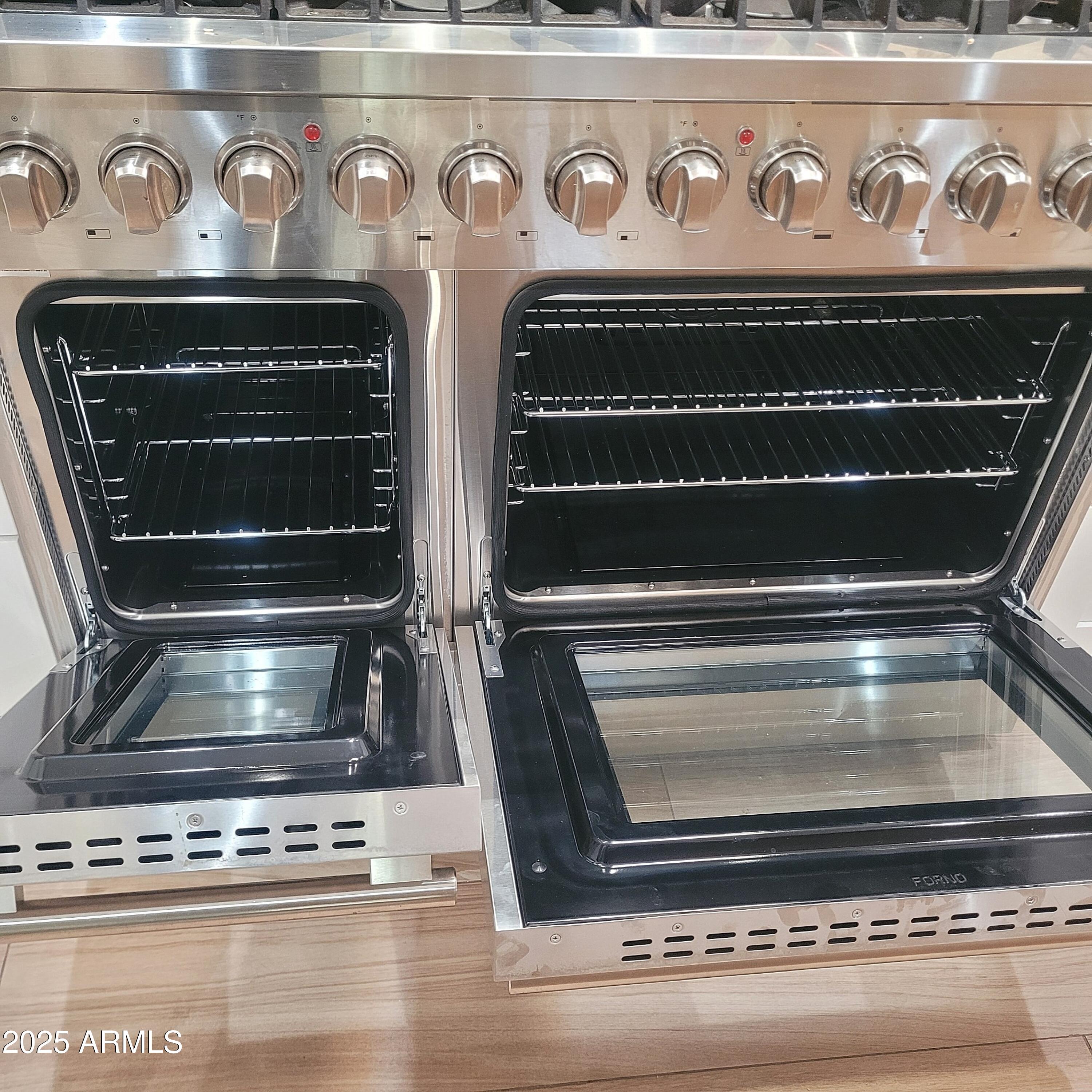 4028 East Edgemont Avenue Phoenix, AZ 85018 - Photo 9 of 27 a stove top oven sitting inside of a kitchen