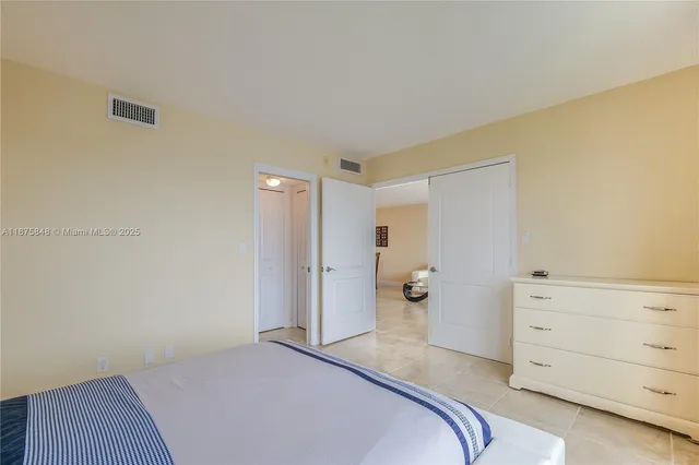 a bedroom with a bed and closet