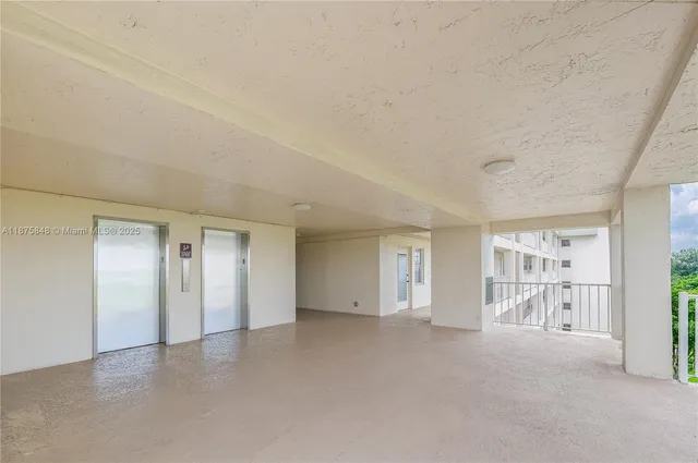 a bathroom with a shower and closet